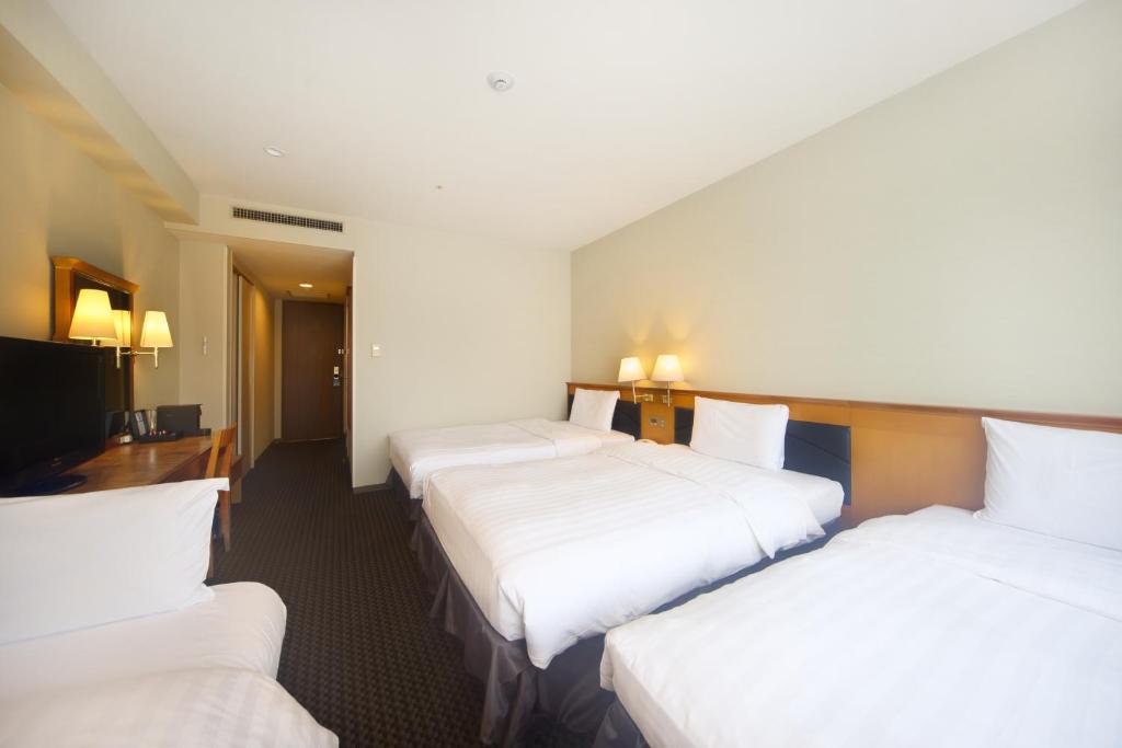 Postel nebo postele na pokoji v ubytování Hotel Nikko Nara