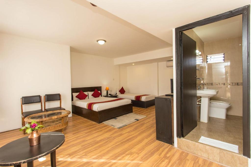 Postel nebo postele na pokoji v ubytování Thamel Eco Resort