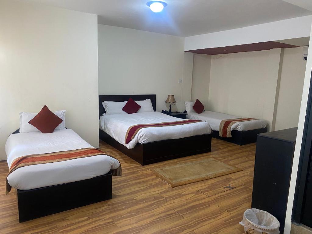 Postel nebo postele na pokoji v ubytování Thamel Eco Resort