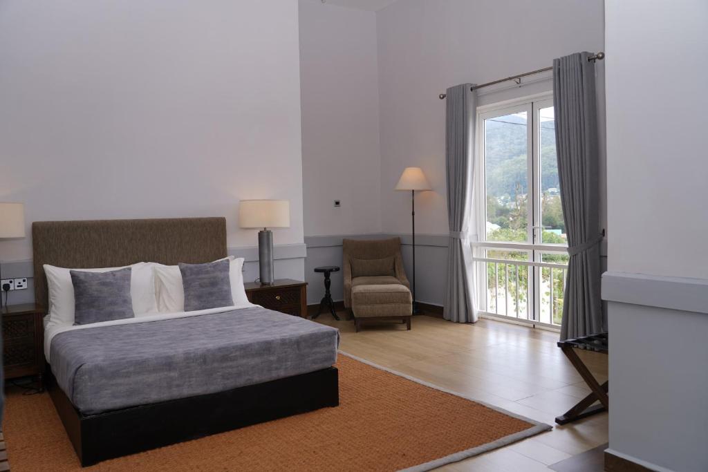 Postel nebo postele na pokoji v ubytování W15 Glenfall Nuwara Eliya