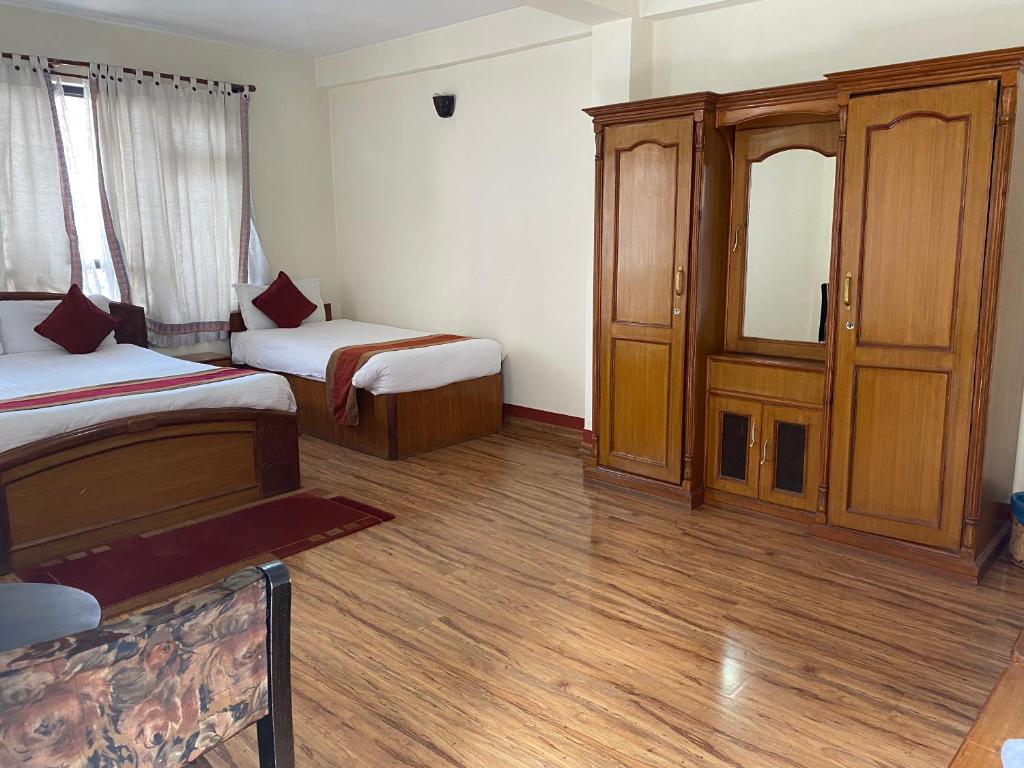 Postel nebo postele na pokoji v ubytování Thamel Eco Resort