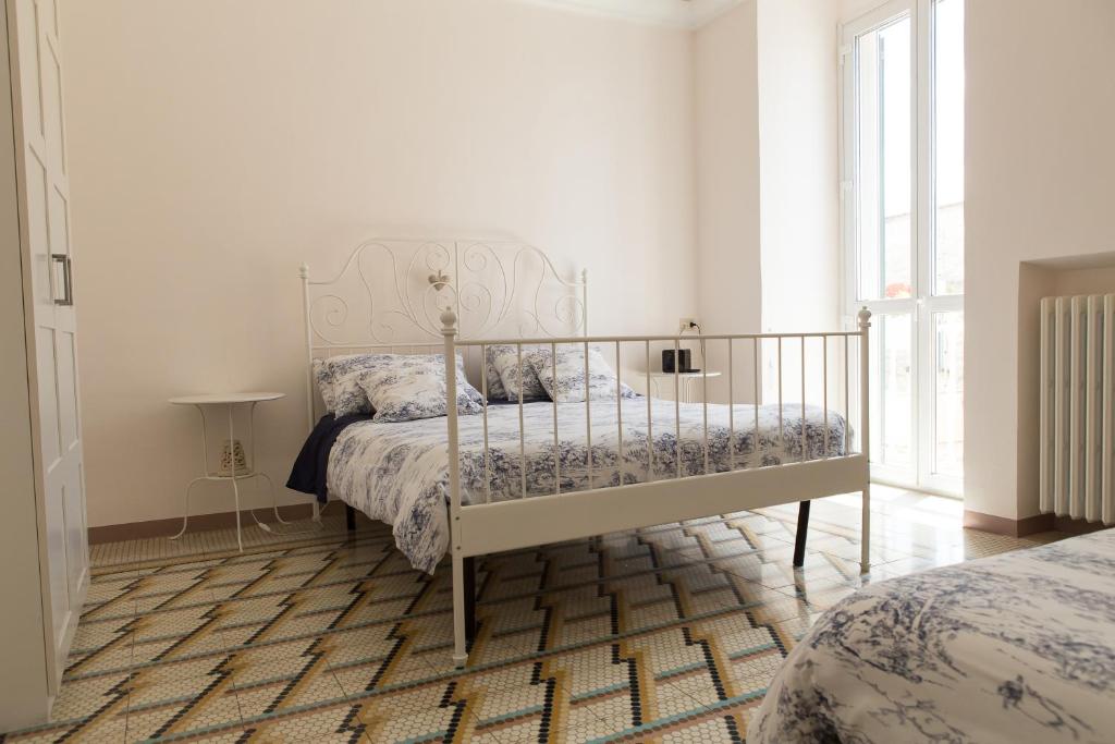 A bed or beds in a room at Ci Vediamo a Casa
