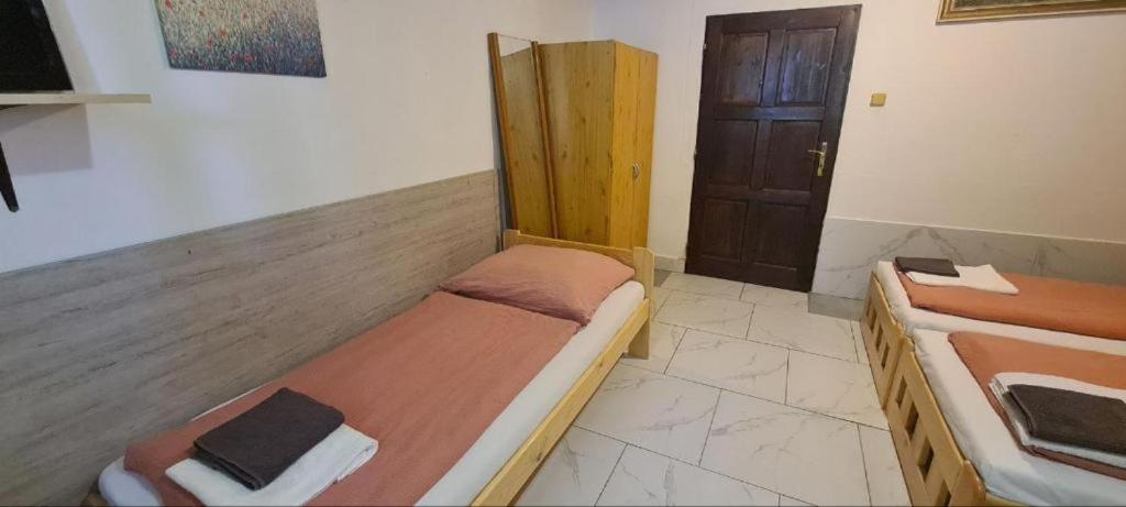 Postel nebo postele na pokoji v ubytování Penzion Vysehrad NonStop