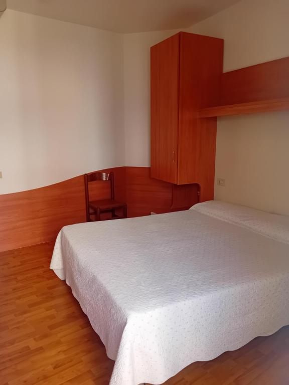 Postel nebo postele na pokoji v ubytování Hotel Galles