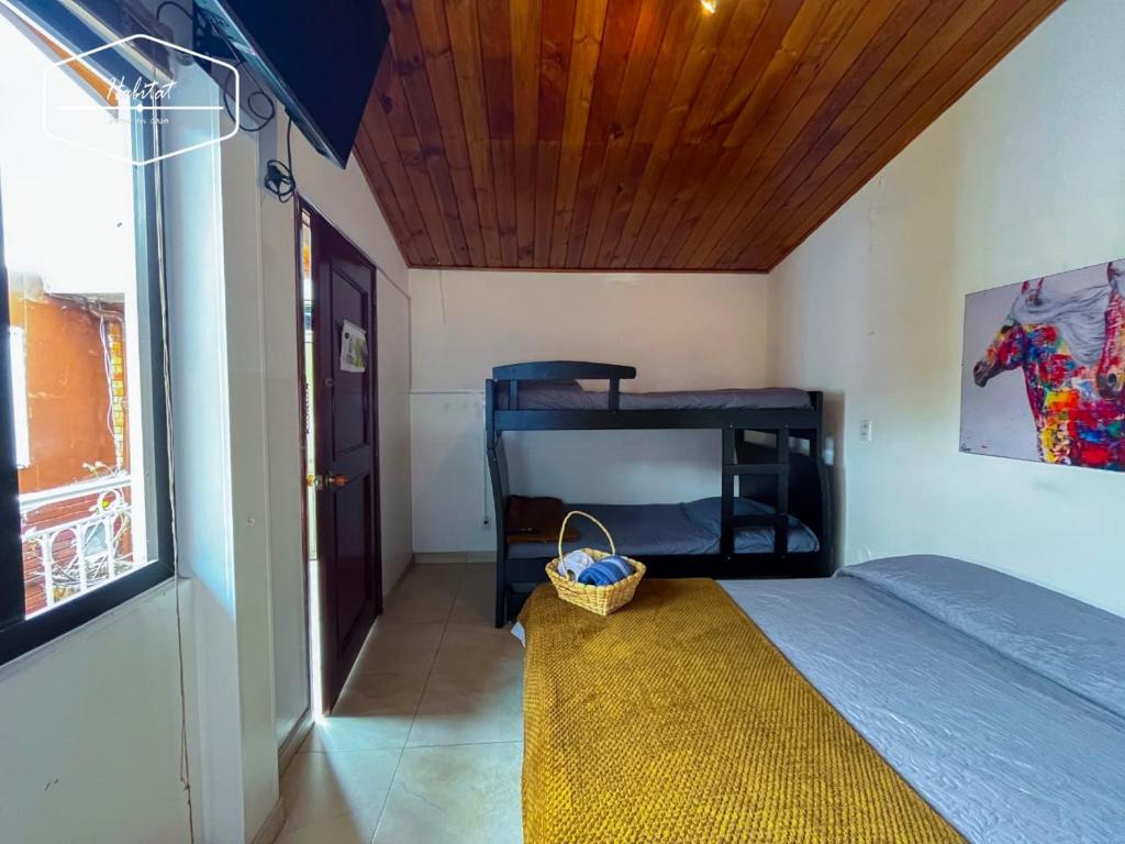 Postel nebo postele na pokoji v ubytování Hotel Habitat Hospedaje
