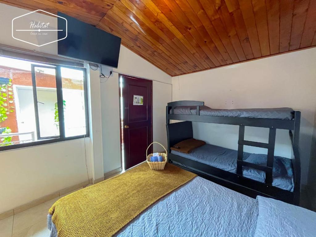 Postel nebo postele na pokoji v ubytování Hotel Habitat Hospedaje