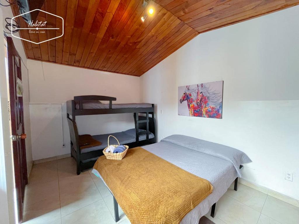 Postel nebo postele na pokoji v ubytování Hotel Habitat Hospedaje