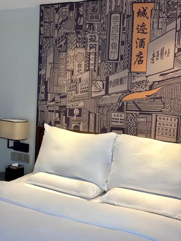 Postel nebo postele na pokoji v ubytování Guangzhou City Join Hotel Shipai Qiao metro Branch