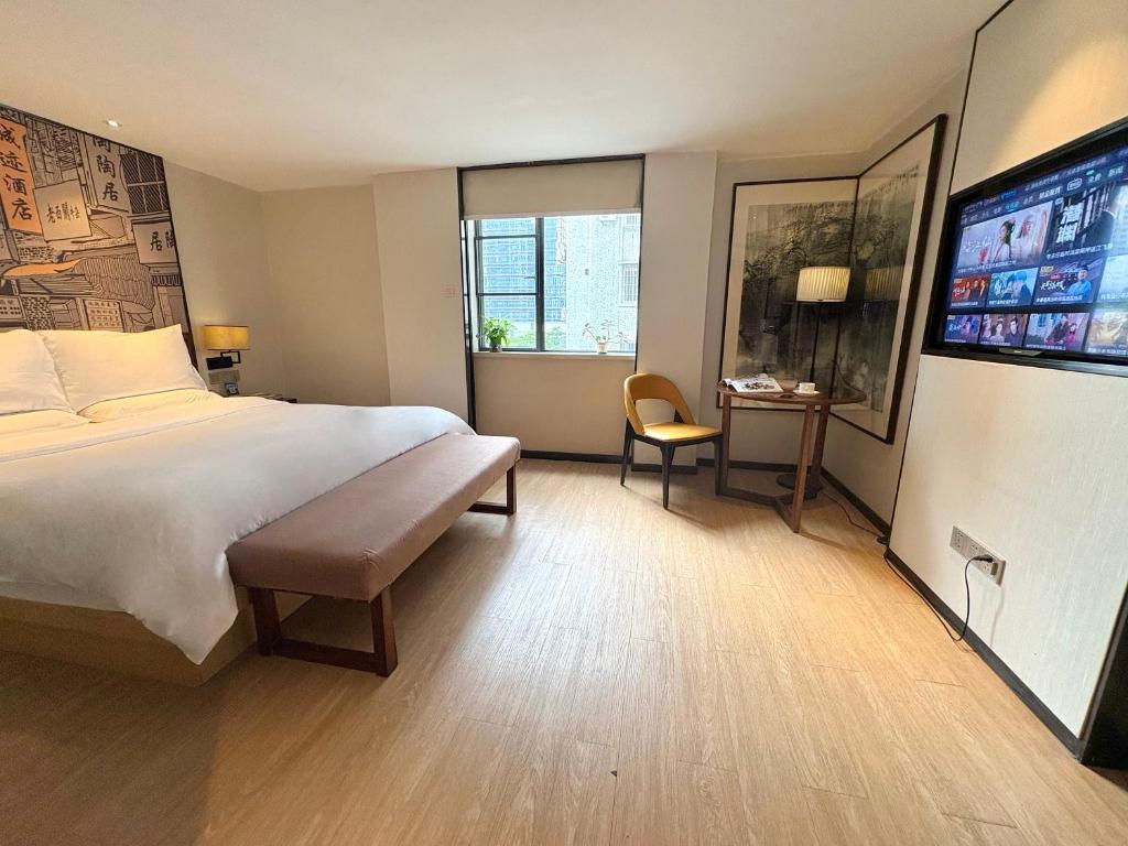 Postel nebo postele na pokoji v ubytování Guangzhou City Join Hotel Shipai Qiao metro Branch