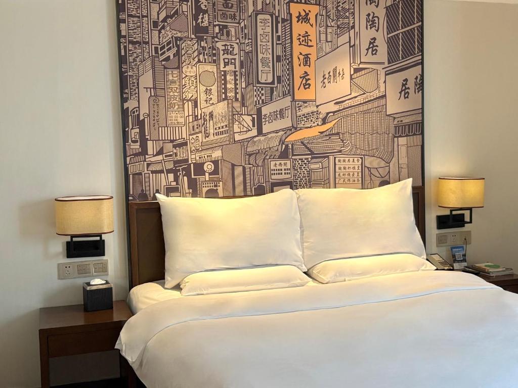 Postel nebo postele na pokoji v ubytování Guangzhou City Join Hotel Shipai Qiao metro Branch