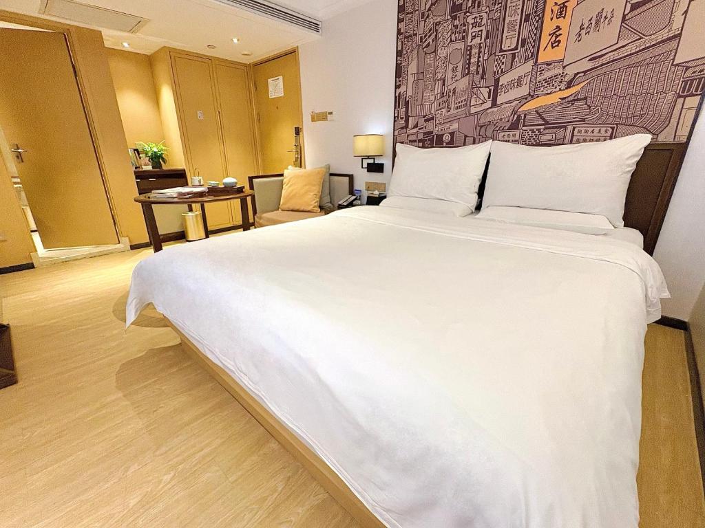 Postel nebo postele na pokoji v ubytování Guangzhou City Join Hotel Shipai Qiao metro Branch