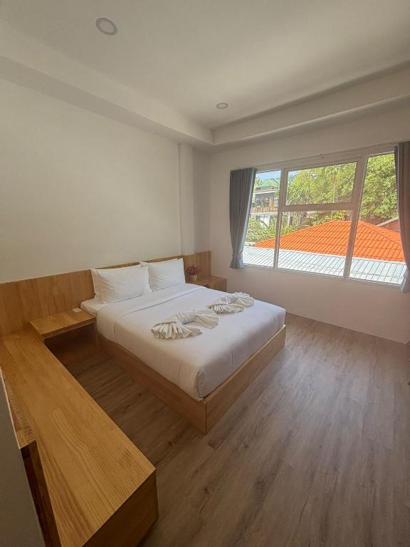 Postel nebo postele na pokoji v ubytování Ibiza Beach Club Koh Tao