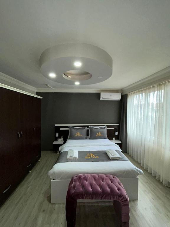 Postel nebo postele na pokoji v ubytování SARA SUİT HOTEL