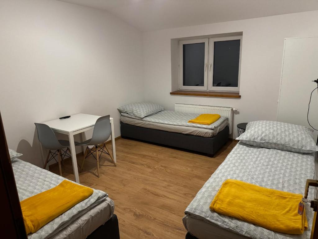 Ένα ή περισσότερα κρεβάτια σε δωμάτιο στο Łysokanie, Niepołomice , noclegi, kwatery dla firm, pokoje