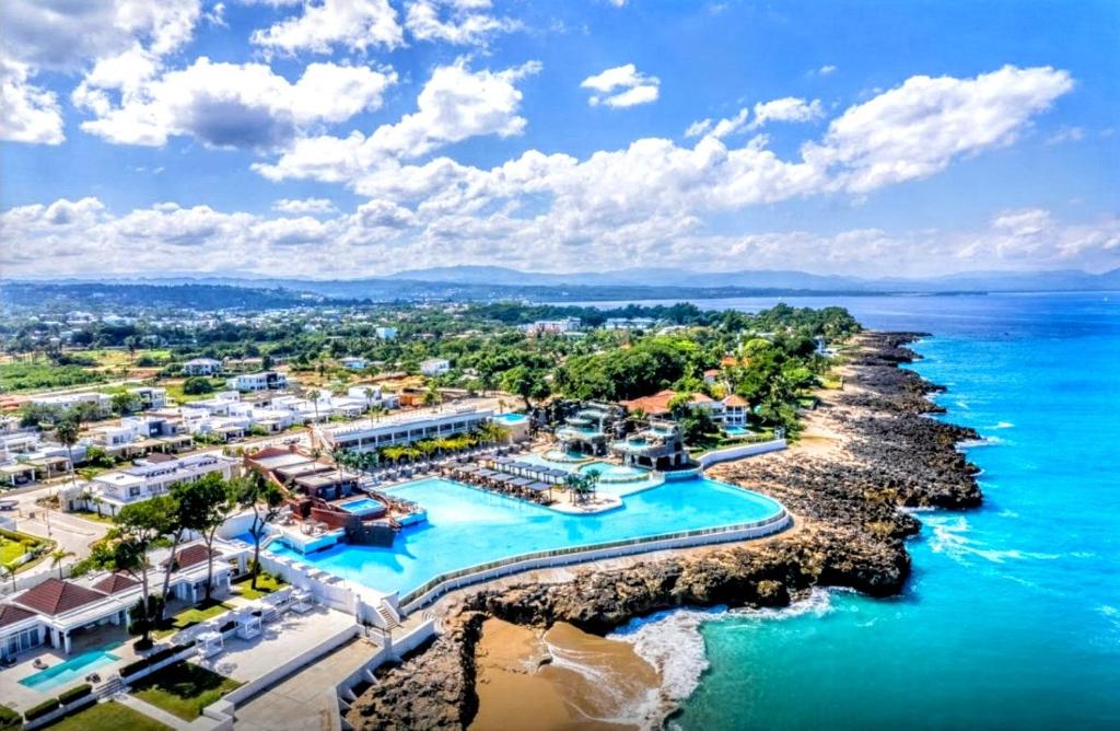 an aerial view of the resort and the ocean at NEW Luxury at Sosua Ocean Village Laguna City in Sosúa