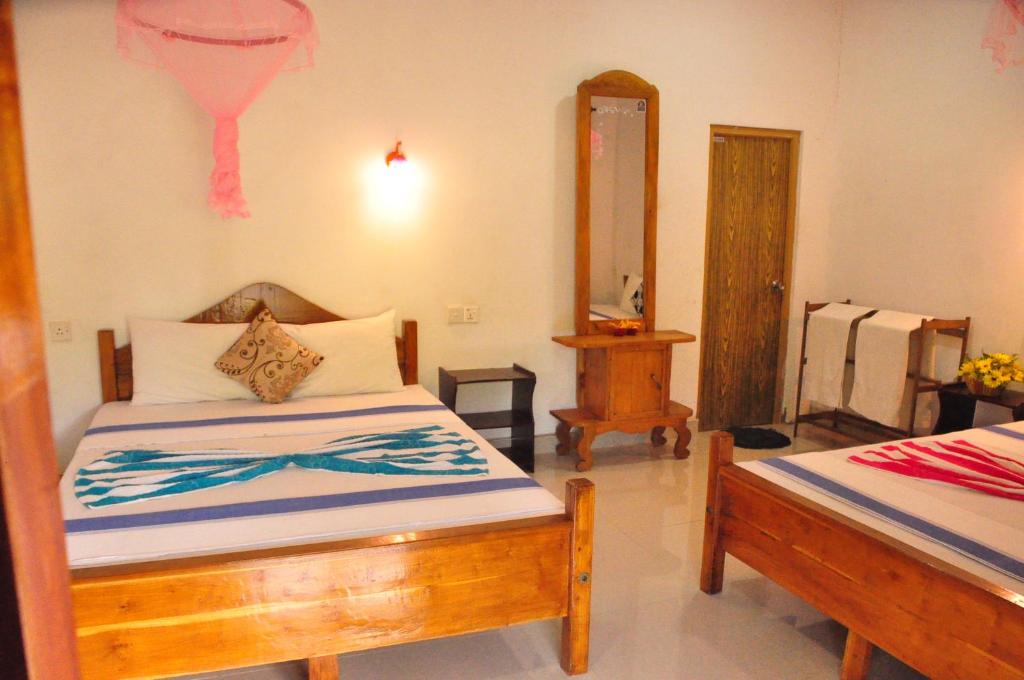 Postel nebo postele na pokoji v ubytování Horizon Resort & Hostel Sigiriya