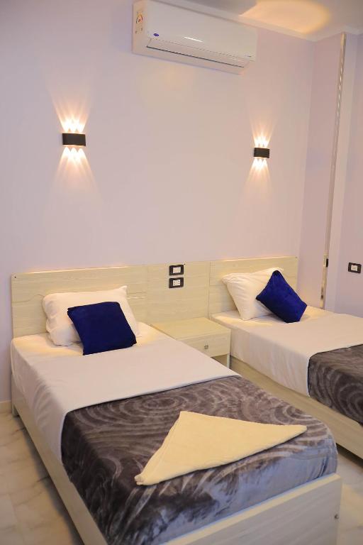 Tempat tidur dalam kamar di Rayan Nubian Guest House