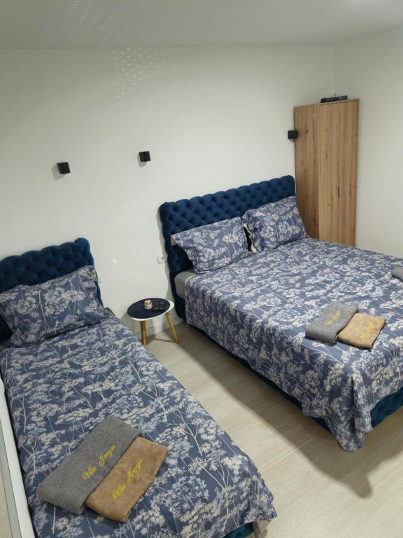 Postel nebo postele na pokoji v ubytování Apartman Jorgic