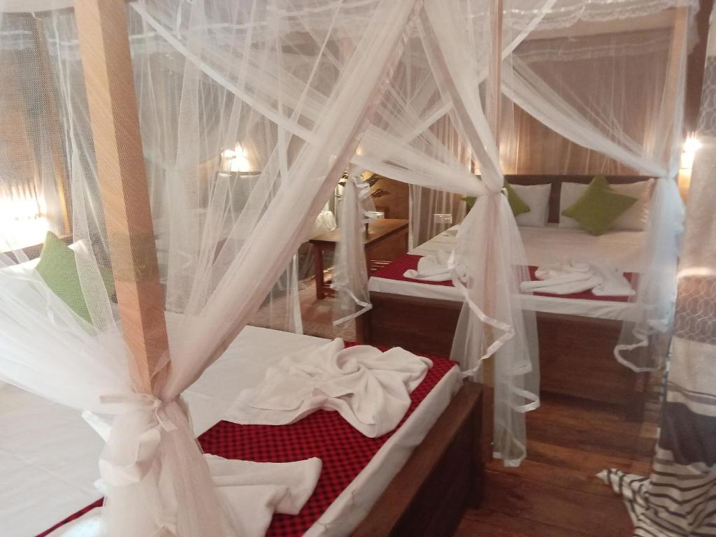 Postel nebo postele na pokoji v ubytování Kolon Resort Sigiriya