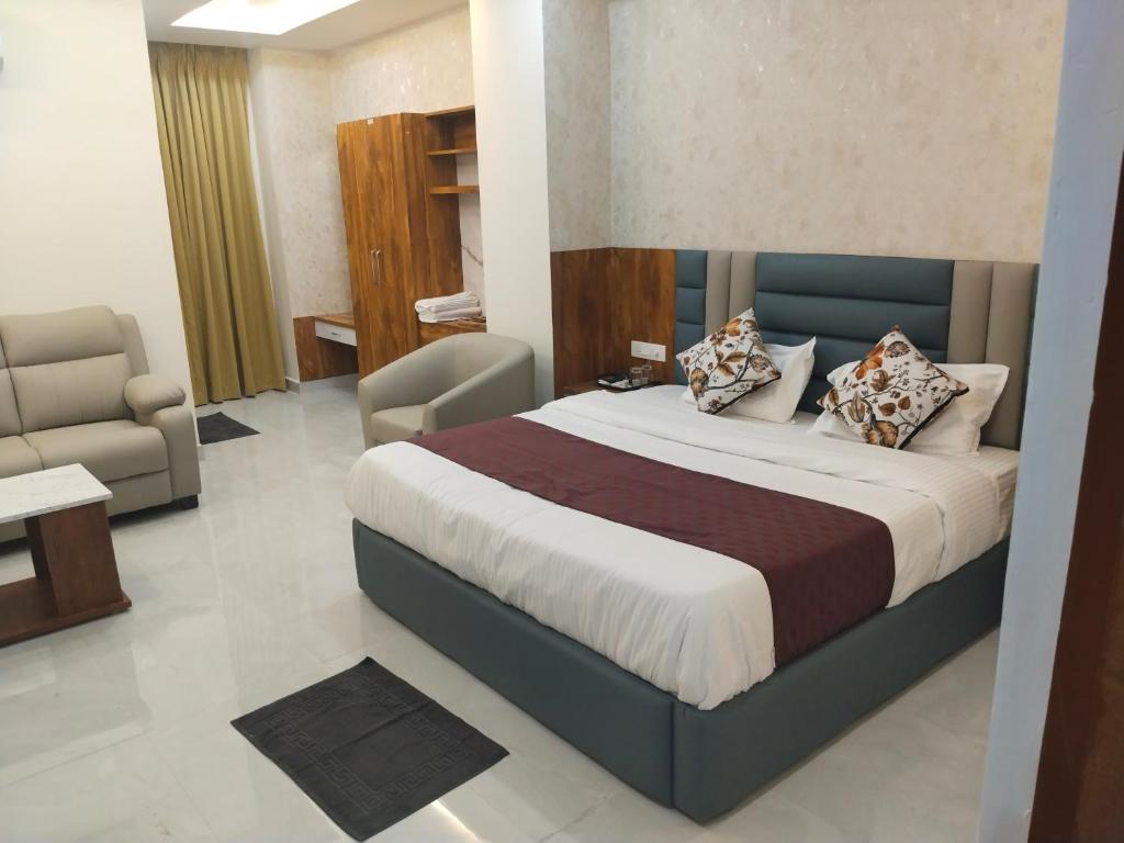 Voodi või voodid majutusasutuse Hotel Phalguna Residency toas