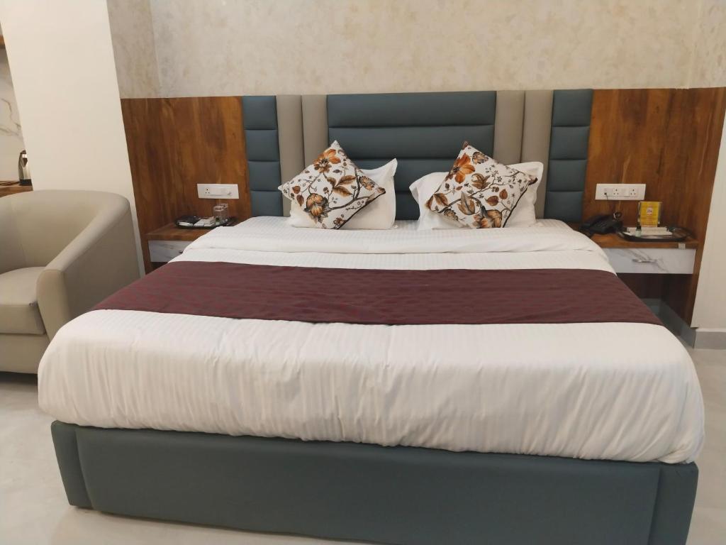 Voodi või voodid majutusasutuse Hotel Phalguna Residency toas
