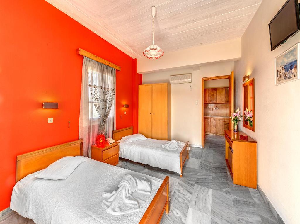 Postel nebo postele na pokoji v ubytování Hotel Smaragdi Apartments