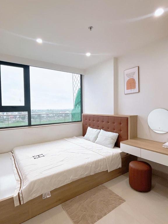 Postel nebo postele na pokoji v ubytování Minh Anh Villa & Apartment