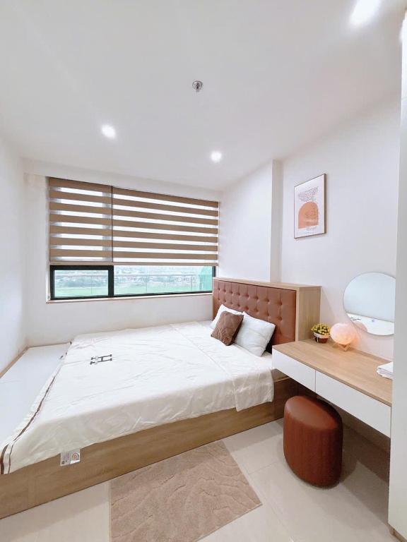 Postel nebo postele na pokoji v ubytování Minh Anh Villa & Apartment