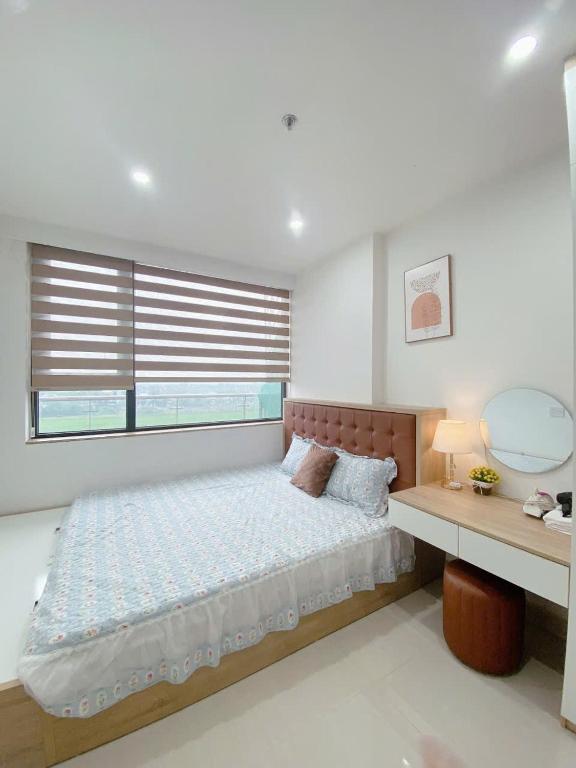 Postel nebo postele na pokoji v ubytování Minh Anh Villa & Apartment