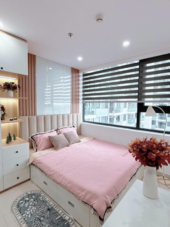 Postel nebo postele na pokoji v ubytování Minh Anh Villa & Apartment