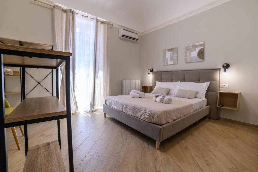 Ένα ή περισσότερα κρεβάτια σε δωμάτιο στο Oros rooms