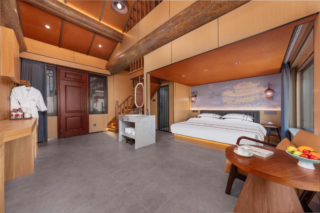 Postel nebo postele na pokoji v ubytování Xingshengjiu Courtyard Hotel Pingyao