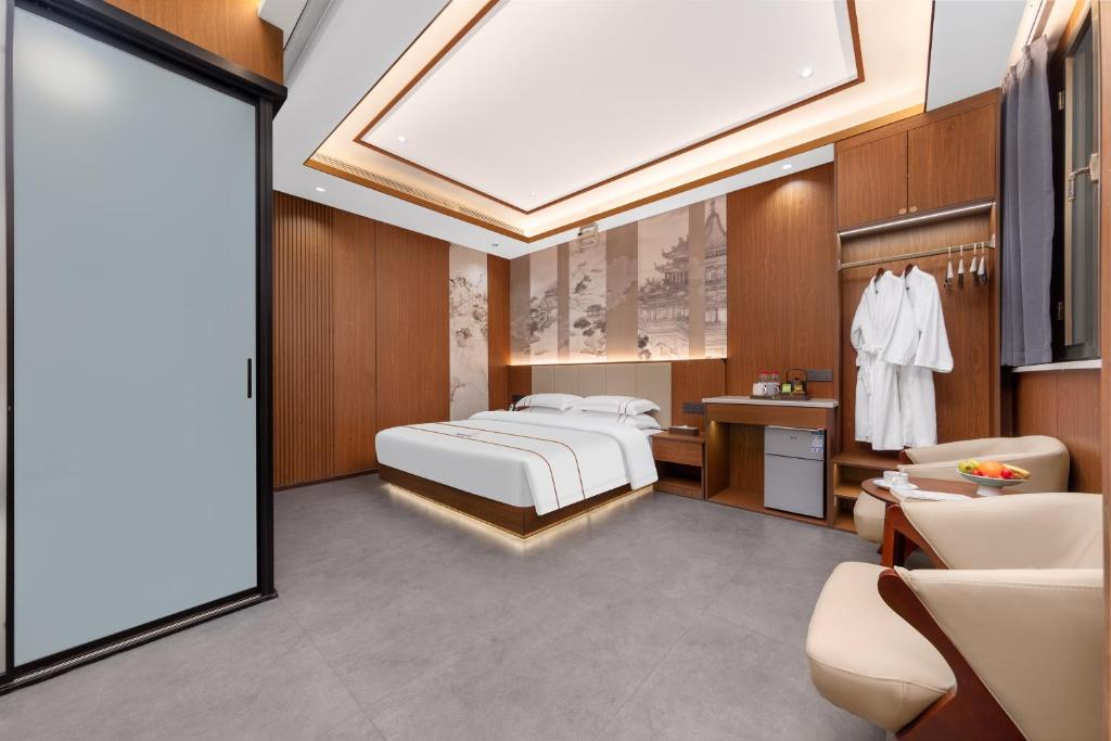 Postel nebo postele na pokoji v ubytování Xingshengjiu Courtyard Hotel Pingyao