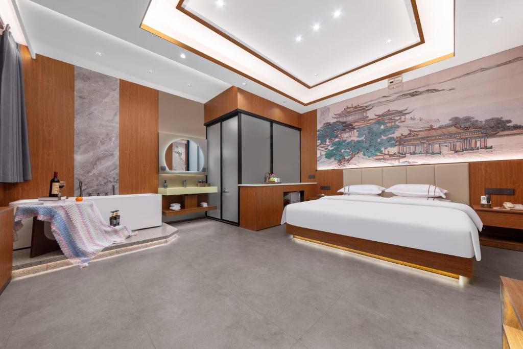Postel nebo postele na pokoji v ubytování Xingshengjiu Courtyard Hotel Pingyao