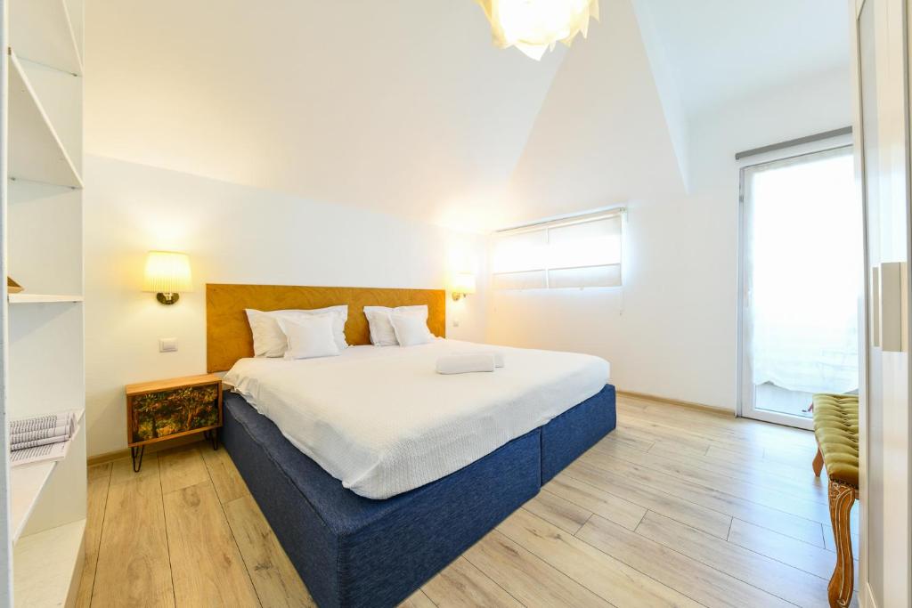 Postel nebo postele na pokoji v ubytování Cluj Napoca Apartments