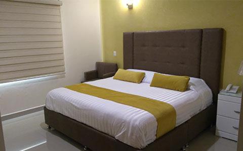 Postel nebo postele na pokoji v ubytování Hotel Tierra Roja