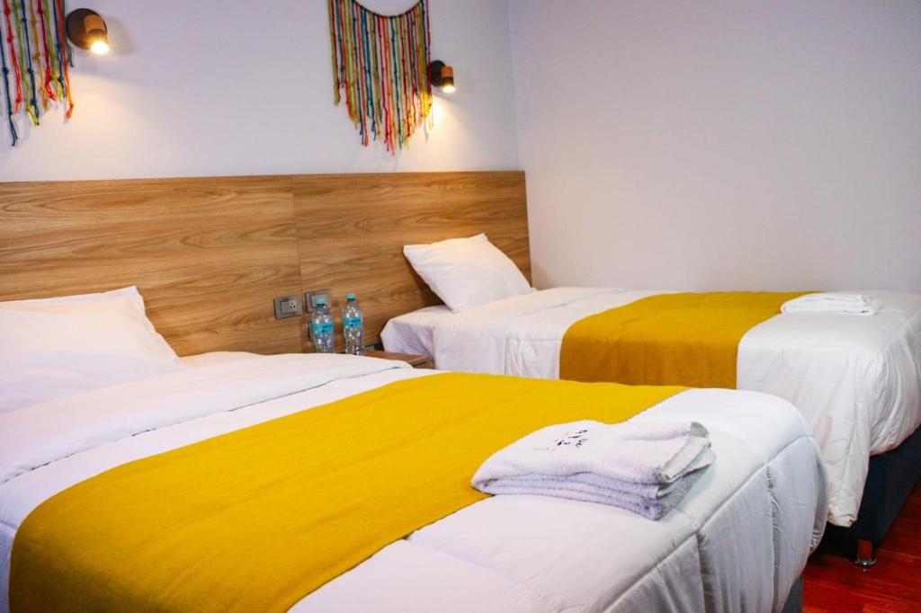 Postel nebo postele na pokoji v ubytování Hotel Litan Machu Picchu