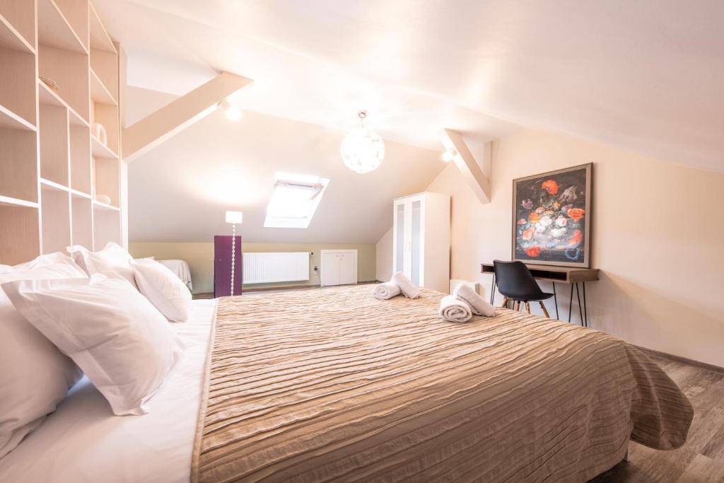 Postel nebo postele na pokoji v ubytování Cluj Napoca Apartments