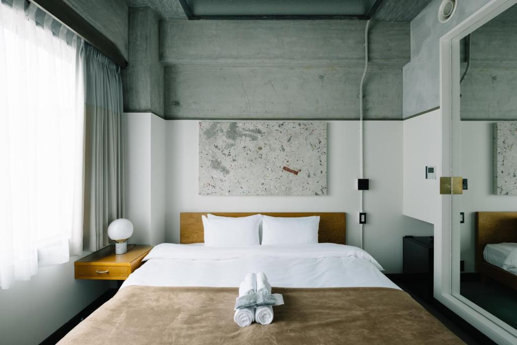 Postel nebo postele na pokoji v ubytování HOTEL Inc