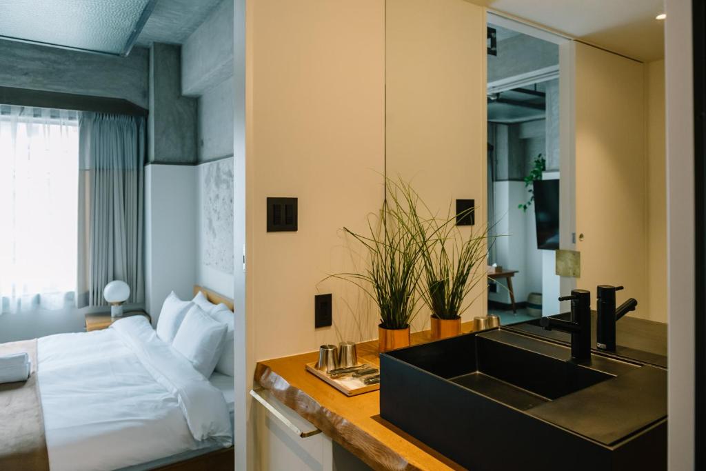 Postel nebo postele na pokoji v ubytování HOTEL Inc