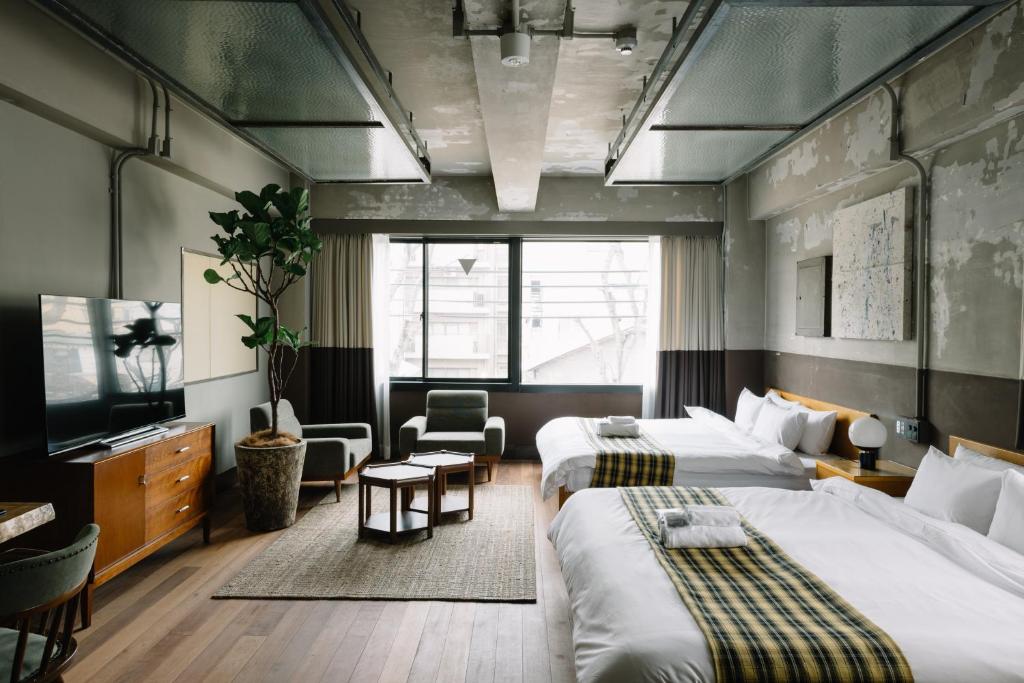 Postel nebo postele na pokoji v ubytování HOTEL Inc