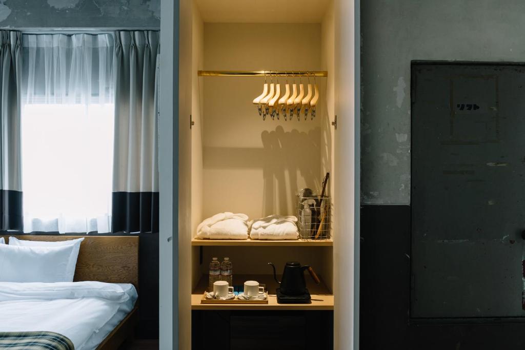 Postel nebo postele na pokoji v ubytování HOTEL Inc