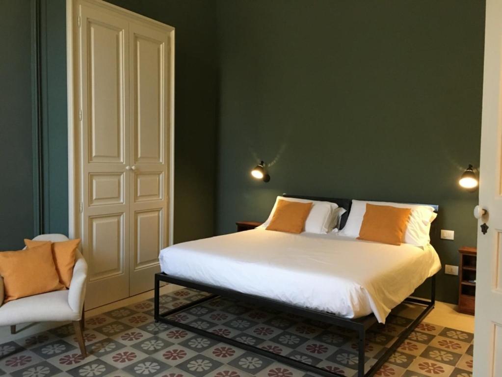 Posteľ alebo postele v izbe v ubytovaní PALAZZO GARZIA - Dimora storica