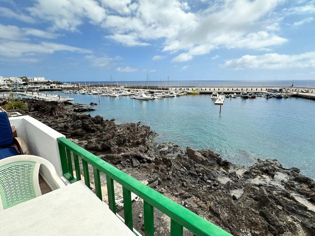 a view of a marina with boats in the water at Roca Negra in Puerto del Carmen