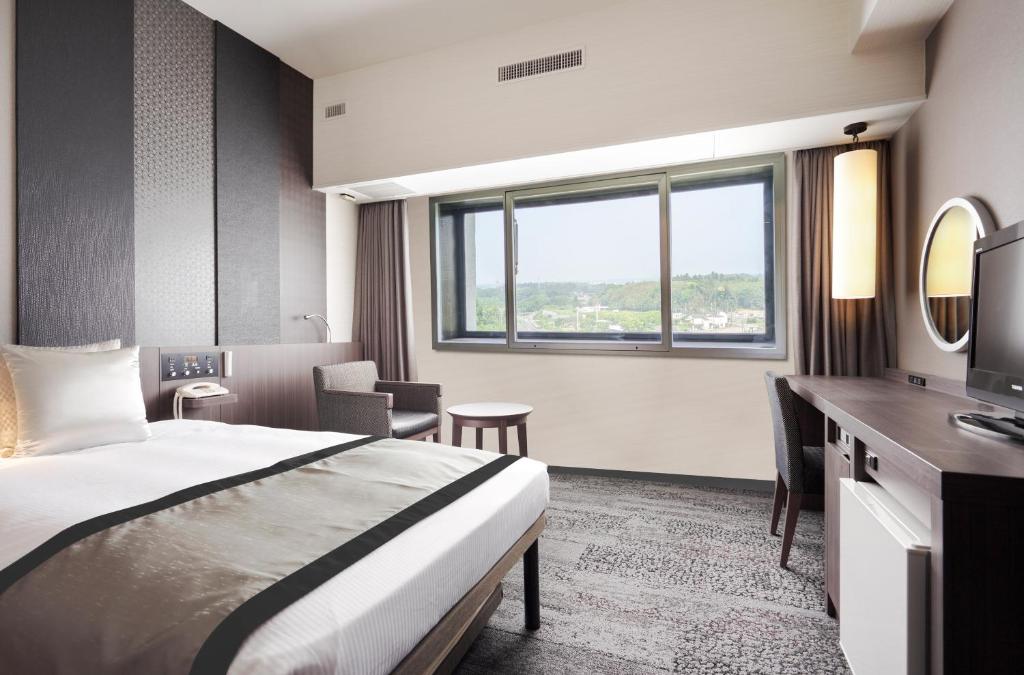 Postel nebo postele na pokoji v ubytování Art Hotel Narita