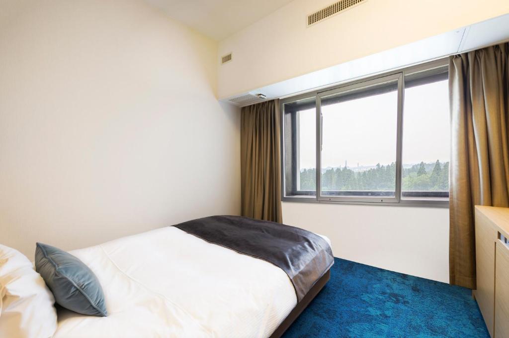 Postel nebo postele na pokoji v ubytování Art Hotel Narita