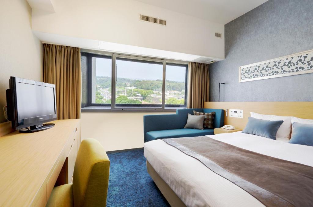 Postel nebo postele na pokoji v ubytování Art Hotel Narita