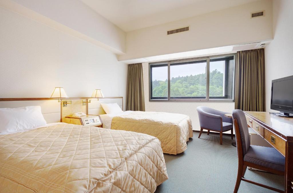 Postel nebo postele na pokoji v ubytování Art Hotel Narita