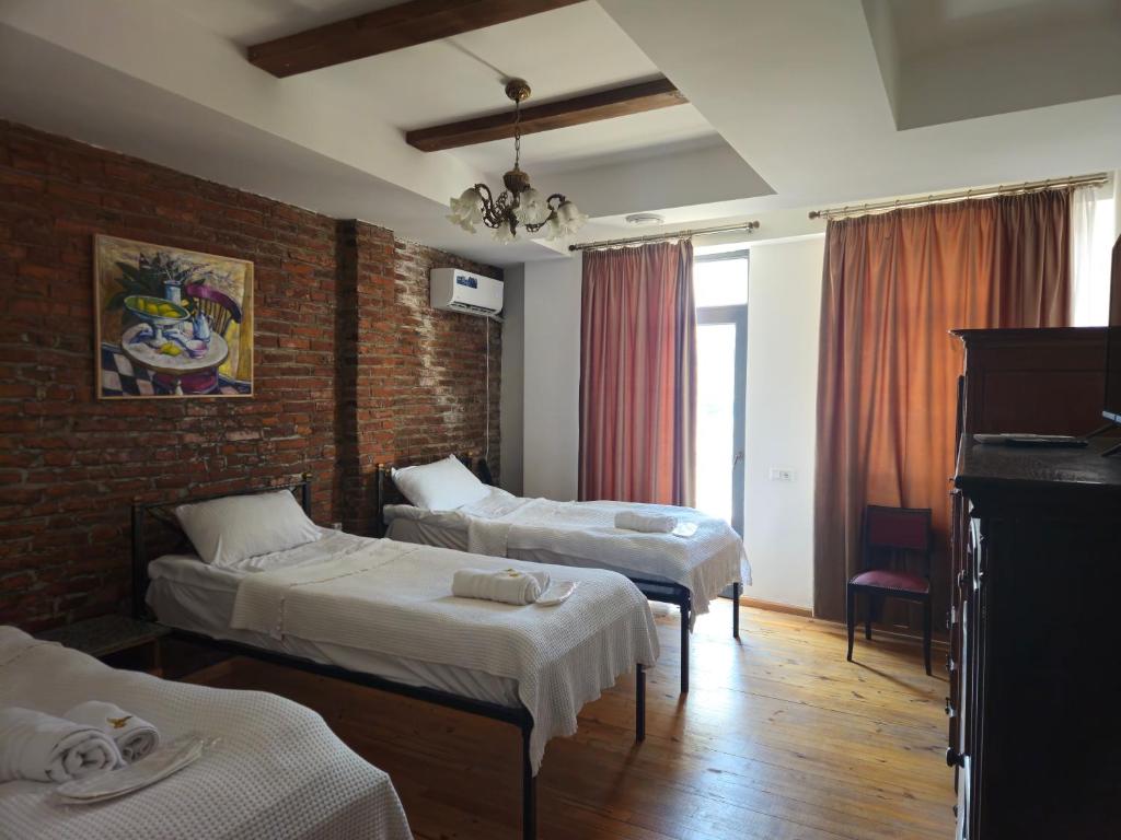 Postel nebo postele na pokoji v ubytování Boutique Hotel Verdzi