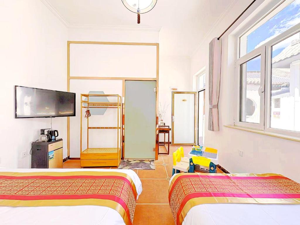 TV a/nebo společenská místnost v ubytování Beijing Great Wall Shiguang Homestay